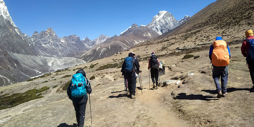 Australian travellers on a spiritual Kailash Mansarovar Yatra tour with Mount Kailash and Mansarovar Lake in the background
