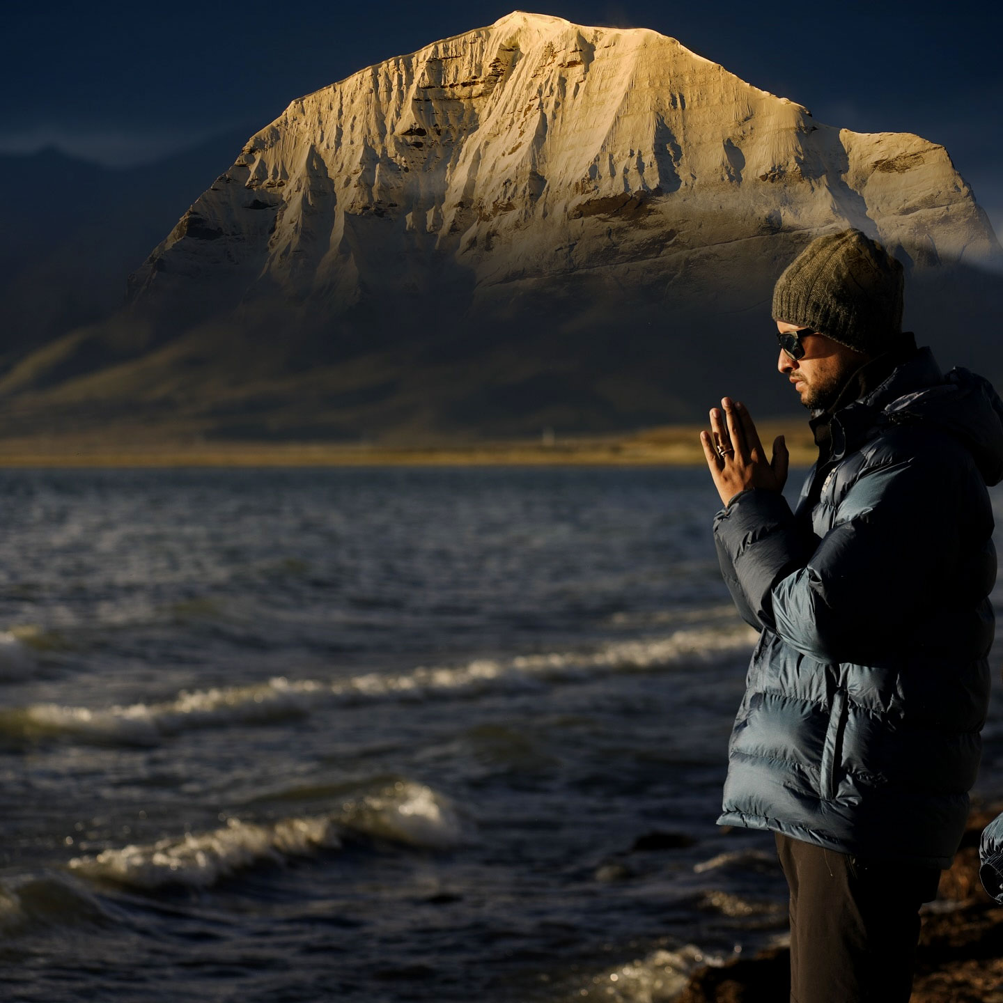 Serene view of sacred Mansarovar Lake reflecting Mount Kailash, symbolizing spiritual stillness and vibrant life energy