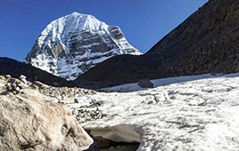 Glacier view of the sacred Mount Kailash peak with snow-covered slopes in Tibet, a spiritual site for pilgrims of Kailash Mansarovar Yatra