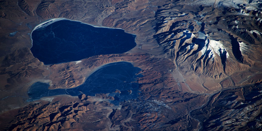 Aerial view of Mount Kailash with the sacred Mansarovar Lake and Rakshas Tal in Tibet, an important pilgrimage site for Kailash Mansarovar Yatra