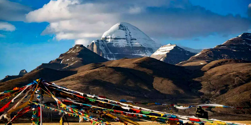 Scenic view of Mount Kailash, the sacred peak revered in Hinduism, Buddhism, Jainism, and Bon, surrounded by Himalayan landscapes.