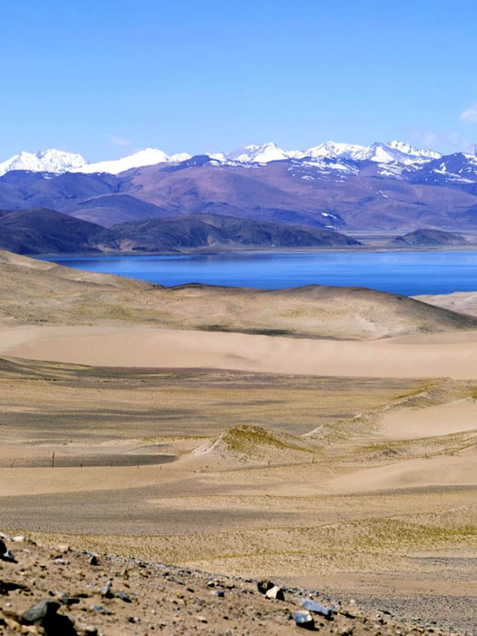 A serene view of Rakshastal Jheel near Mount Kailash, known for its mystical landscape and spiritual significance in Tibet.