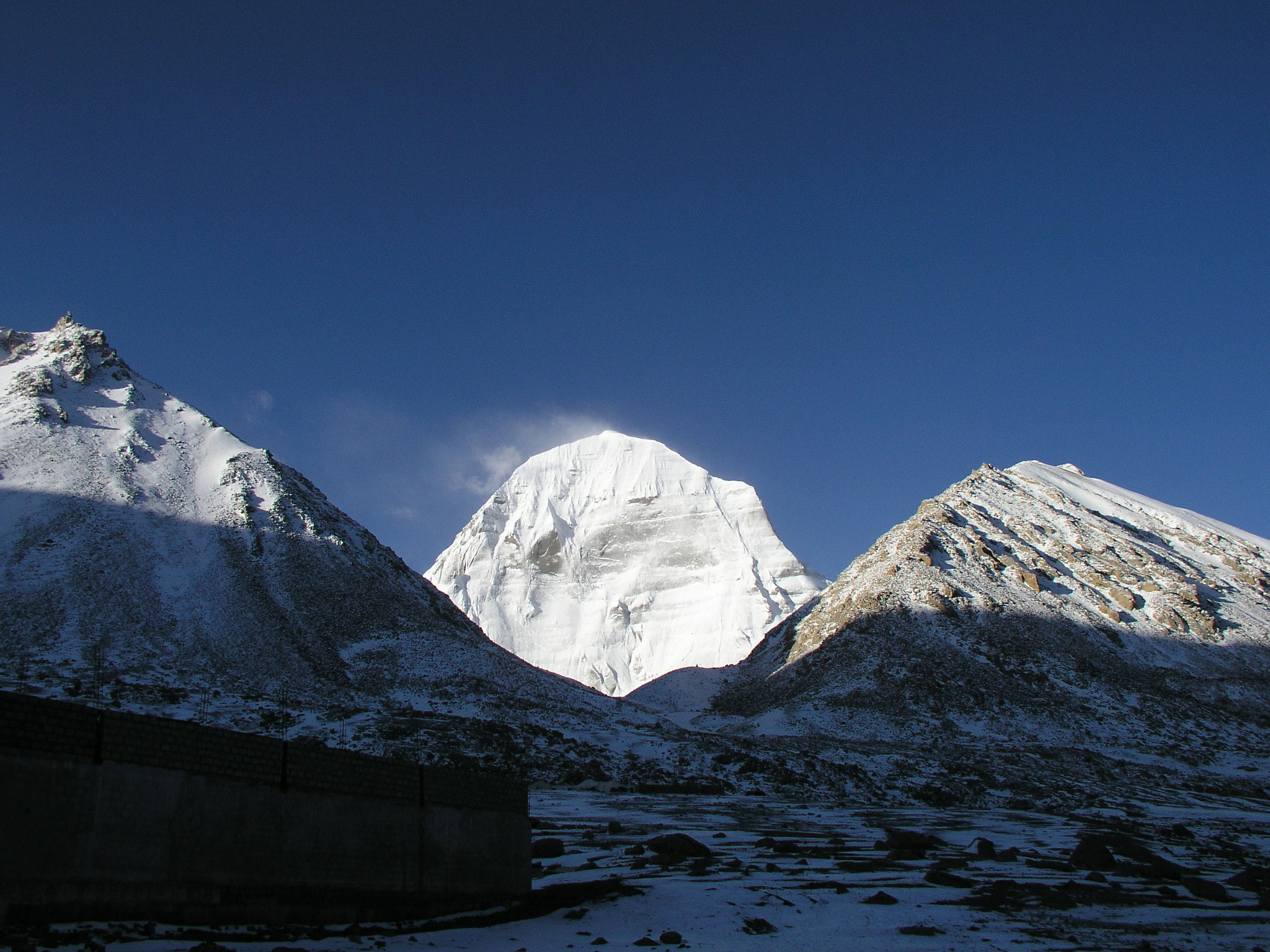 Snow-covered Mount Kailash peak in the Himalayas, a sacred pilgrimage site for Hindus, Buddhists, Jains, and Bon followers.