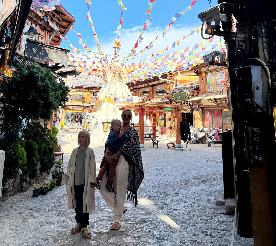 Tibetan monks and pilgrims following cultural and spiritual etiquette at a monastery in Tibet, showing respect for sacred traditions and rituals